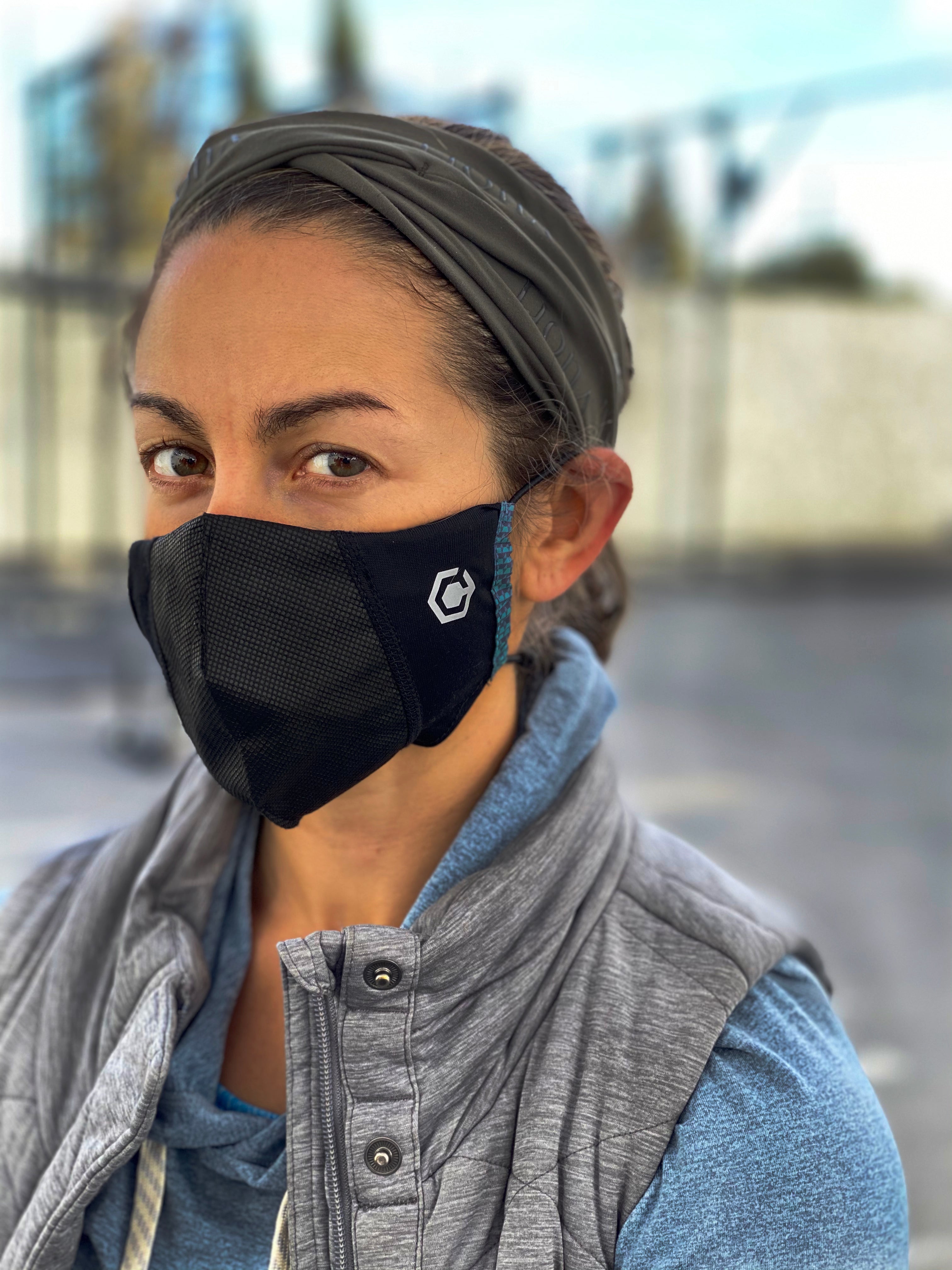 Woman wearing Scorpion Hybrid face mask during squat exercise  